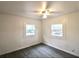 A bright, empty bedroom with wood-look flooring and white paneled walls at 1925 Kerry St, North Charleston, SC 29406