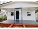 Charming home with a welcoming front porch, dark-blue door, and brick foundation at 1925 Kerry St, North Charleston, SC 29406
