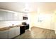 A kitchen with gray cabinets, wood countertops, stainless-steel appliances and wood-look floors at 1925 Kerry St, North Charleston, SC 29406