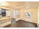 Bright living room with wood-look floors, white walls, and open shelving at 1925 Kerry St, North Charleston, SC 29406