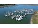 High-angle view of a marina, displaying multiple boats moored at docks within calm, clear waters at 2 Mcdonough Rd # B-11, Folly Beach, SC 29439