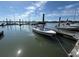 View of boat docked at pier, with other boats and waterfront in the background at 2 Mcdonough Rd # B-11, Folly Beach, SC 29439
