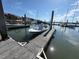 A boat sits tied up at a dock, water surrounding and buildings on the shore visible in the background at 2 Mcdonough Rd # B-11, Folly Beach, SC 29439