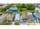 Charming street view of colorful homes with lush green trees and landscaping at 200 Fishburne St, Charleston, SC 29403
