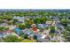 View of a colorful residential neighborhood with mature trees and city skyline in the distance at 200 Fishburne St, Charleston, SC 29403