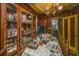 Dining room features a china cabinet, chandelier, and table with covered patterned table cloth at 200 Fishburne St, Charleston, SC 29403