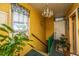 Hallway featuring vibrant colors, a decorative chandelier, stairs and a vintage aesthetic at 200 Fishburne St, Charleston, SC 29403