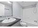 Bright bathroom featuring a shower and tub combination and modern sink vanity at 201 Frank St, Summerville, SC 29483