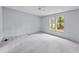 Bright bedroom with a ceiling fan and natural light, offering a comfortable and airy atmosphere at 201 Frank St, Summerville, SC 29483