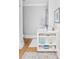 Bright bathroom featuring a marble countertop, decorative shelf, and soft gray accents at 202 Bank St, Mount Pleasant, SC 29464