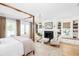 Inviting bedroom with four-poster bed, fireplace, window seat, and decorative chandelier at 202 Bank St, Mount Pleasant, SC 29464