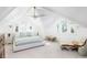 Bright bedroom featuring a large bed, vaulted ceilings, windows, and stylish decor at 202 Bank St, Mount Pleasant, SC 29464