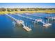 Aerial view of multiple wooden docks extending into the water, offering serene waterfront living at 202 Bank St, Mount Pleasant, SC 29464