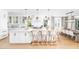 Bright, open kitchen with a large island, pendant lighting, and bar stool seating at the island at 202 Bank St, Mount Pleasant, SC 29464