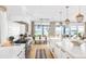 Spacious kitchen with an island, stainless steel appliances, and an adjacent dining area with water views at 202 Bank St, Mount Pleasant, SC 29464