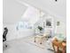 Cozy living room featuring vaulted ceilings, a seating area by the window, and natural light at 202 Bank St, Mount Pleasant, SC 29464