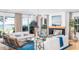 Bright living room with comfortable seating, a view of the water, and elegant decor at 202 Bank St, Mount Pleasant, SC 29464