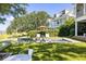 Inviting pool area surrounded by lush landscaping, perfect for enjoying sunny days and outdoor living at 202 Bank St, Mount Pleasant, SC 29464