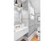 Stylish powder room features patterned wallpaper, modern sink, and brass fixtures at 202 Bank St, Mount Pleasant, SC 29464