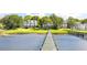 Beautiful waterfront homes with private docks and lush green lawns, showcasing an idyllic coastal lifestyle at 202 Bank St, Mount Pleasant, SC 29464