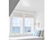 Bright window seat with views of the water, featuring comfortable cushions and a reading light at 202 Bank St, Mount Pleasant, SC 29464