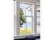 Scenic water view seen through multi-pane windows, bringing the beauty of the outdoors inside at 202 Bank St, Mount Pleasant, SC 29464