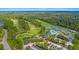 Aerial view of the country club, including the golf course, pool, and tennis courts at 203 Yeamans Way, Summerville, SC 29483