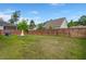 Spacious fenced backyard featuring a cozy fire pit and grill at 203 Yeamans Way, Summerville, SC 29483