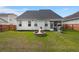 Beautiful backyard featuring a cozy fire pit and stainless steel grill at 203 Yeamans Way, Summerville, SC 29483