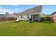 Well-maintained backyard featuring a fire pit, screened-in porch and stainless steel grill at 203 Yeamans Way, Summerville, SC 29483