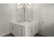 Clean bathroom with double sinks, modern fixtures, and a neutral color scheme at 203 Yeamans Way, Summerville, SC 29483