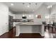 Bright eat-in kitchen featuring white cabinets, a stainless steel refrigerator, and granite countertops at 203 Yeamans Way, Summerville, SC 29483