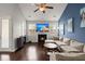 Comfortable living room with fireplace, TV, and bar area great for entertaining at 203 Yeamans Way, Summerville, SC 29483