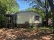Charming single-story home with mature trees, complemented by a cozy porch and a well-kept yard at 2041 Covey Ln, Charleston, SC 29412