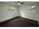 Bright, empty bedroom with modern fan, hardwood floors and natural light at 208 Orange St, Walterboro, SC 29488
