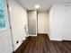 Utility room with washer and dryer hookups, modern floors, and an adjacent storage area at 208 Orange St, Walterboro, SC 29488