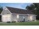 Detached garage with carriage door and adjoining studio features stylish design and ample space at 2101 Wappoo Dr, Charleston, SC 29412