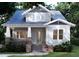 Charming craftsman-style home with inviting front porch and brick accents offers timeless curb appeal at 2101 Wappoo Dr, Charleston, SC 29412
