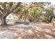A playground with a picnic area, play structures, and mature trees at 2101 Wappoo Dr, Charleston, SC 29412