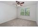 Bright bedroom with neutral carpet and a window overlooking a leafy yard at 215 Jackson St, Goose Creek, SC 29445