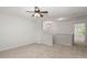 Neutral bedroom featuring neutral carpet, ceiling fan, and view to the hall at 215 Jackson St, Goose Creek, SC 29445