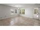 Dining area featuring tile flooring, bright light with multiple windows, and convenient access to outdoor patio at 215 Jackson St, Goose Creek, SC 29445