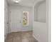 Bright entryway featuring neutral tile flooring, an alcove, white trim and walls, and a window with natural light at 215 Jackson St, Goose Creek, SC 29445