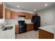 Modern kitchen with stainless steel appliances, and wooden cabinets at 215 Jackson St, Goose Creek, SC 29445