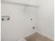 Utility room with tile floor, washer and dryer hookups, and a wire rack for storage at 215 Jackson St, Goose Creek, SC 29445