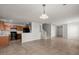 Bright living room with tile floors, staircase, and kitchen area at 215 Jackson St, Goose Creek, SC 29445