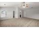 Bright main bedroom with neutral carpet, ceiling fan, and access to ensuite and closet at 215 Jackson St, Goose Creek, SC 29445