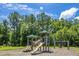 Community playground features a slide and swing set for Gathering fun at 215 Jackson St, Goose Creek, SC 29445