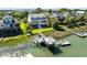 Aerial view of waterfront home with private dock, boat lift, and lush surroundings at 2363 Palmer Creek Bnd, Charleston, SC 29412