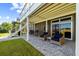 Comfortable back patio space with outdoor seating and a beautiful brick flooring at 2363 Palmer Creek Bnd, Charleston, SC 29412